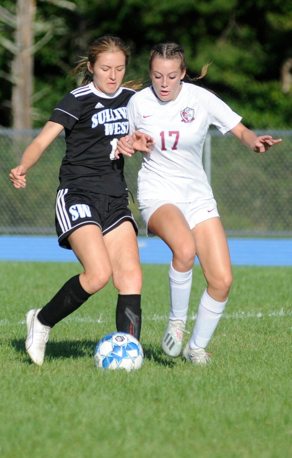 One on one. Sullivan West’s Nicole Reeves and O’Neill’s Madelyn Zdeb.